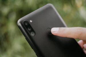 Black Samsung Galaxy M11 showing the fingerprint feature